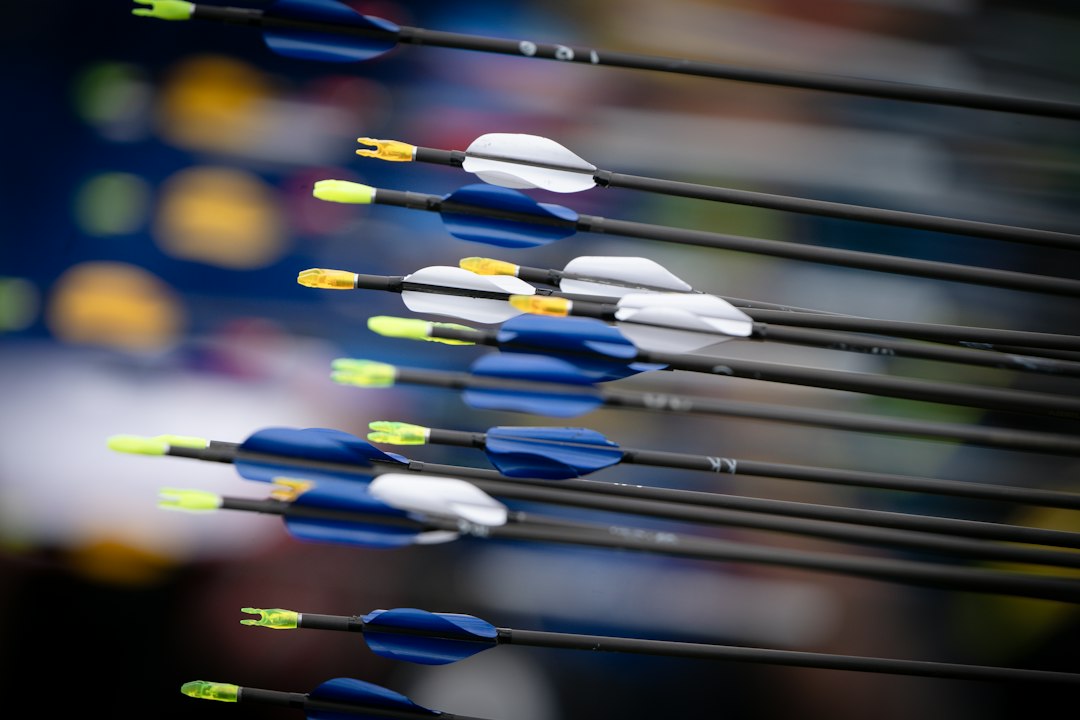 4mm Micro-Diameter Arrows: Benefits, Trade-Offs, and How to Choose 1 Archery arrows with blue and white fletching and yellow nocks