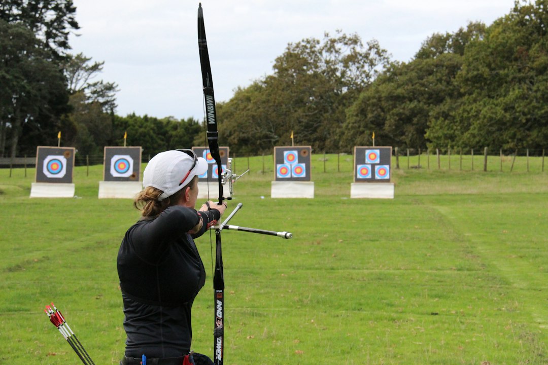 How to Aim a Recurve Bow: Sight Alignment for Beginners 1 Arrow leaving a bow during archery practice