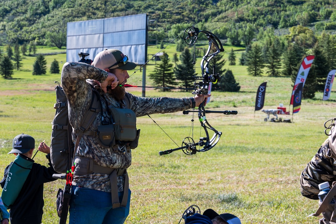 How to Paper Tune a Compound Bow: Step-by-Step Guide 1 Archer shooting a compound bow